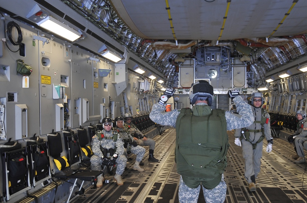 Soldiers and Marines Leap from C-17