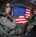 Flying high again: Soldier reenlists on helicopter over southern Iraq