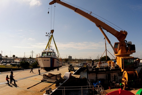 US Coast Guard crew members deliver a utility boat to Haitian Coast Guard