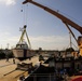 US Coast Guard crew members deliver a utility boat to Haitian Coast Guard