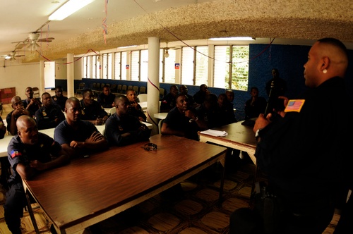 US Coast Guard members train Haitian Coast Guard members in weapons training