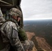 Paratroopers jump from helicopters