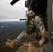 Paratroopers jump from helicopters