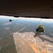 Paratroopers jump from helicopters