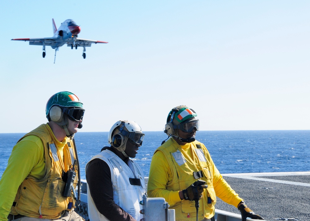 Football player visits USS George H.W. Bush