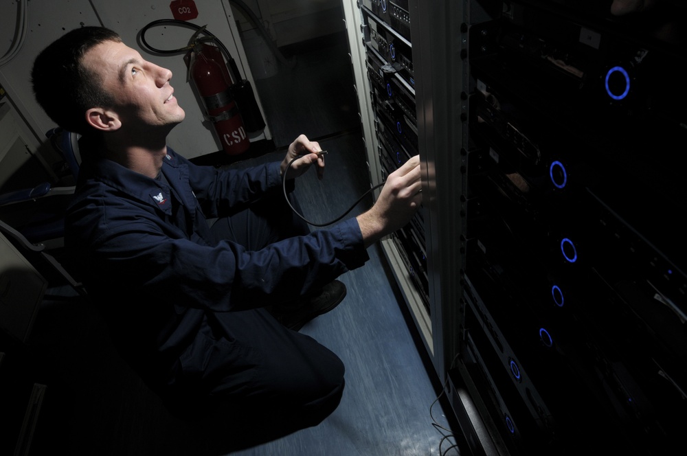 USS Carl Vinson Sailors Perform Maintenance Sea Tel System