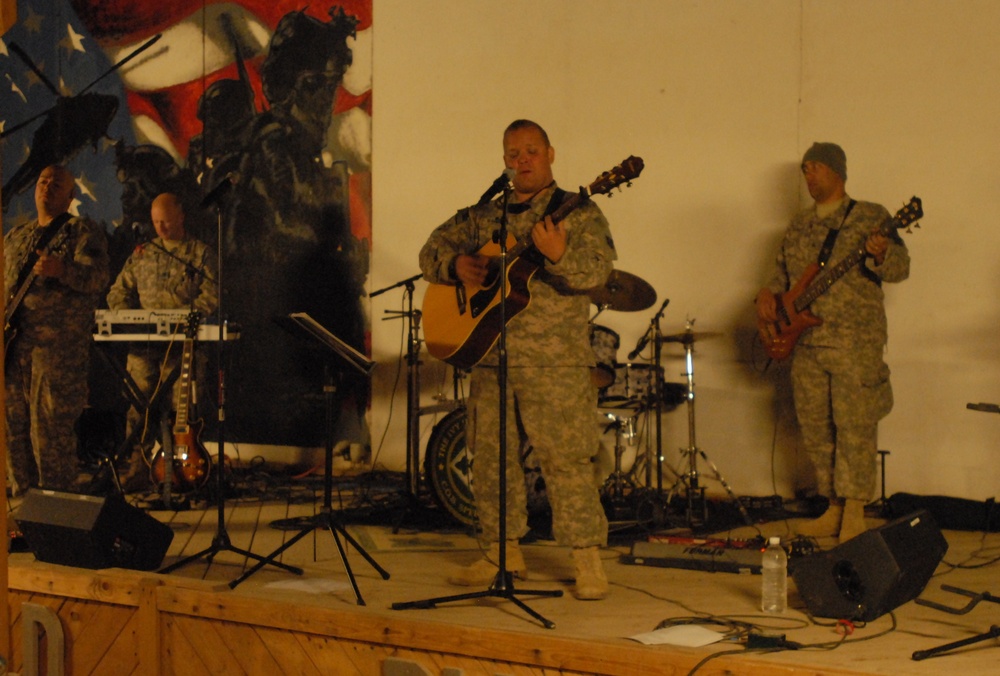 Audience members step in to jam during 4ID Band concert in Iraq