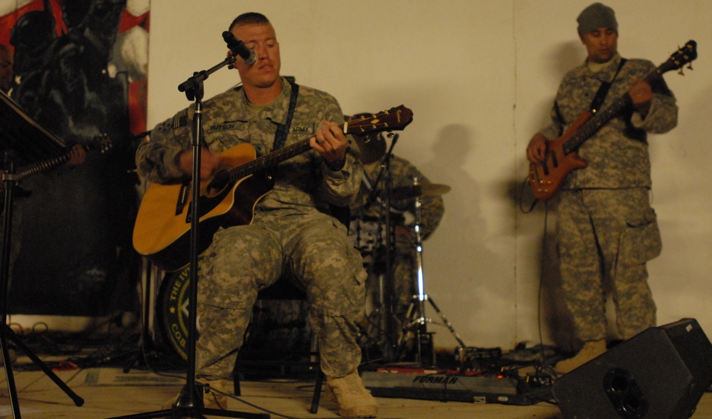 Audience members step in to jam during 4ID Band concert in Iraq