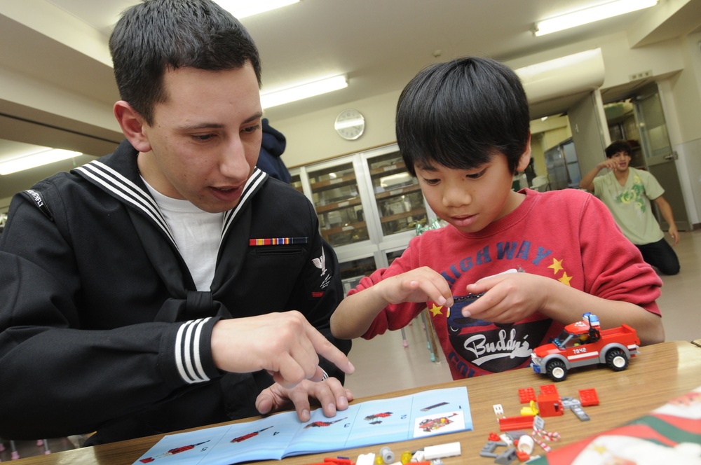 Sailors visit with Orphans