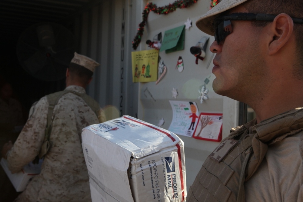 Marines sort packages on Camp Dwyer