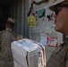 Marines sort packages on Camp Dwyer