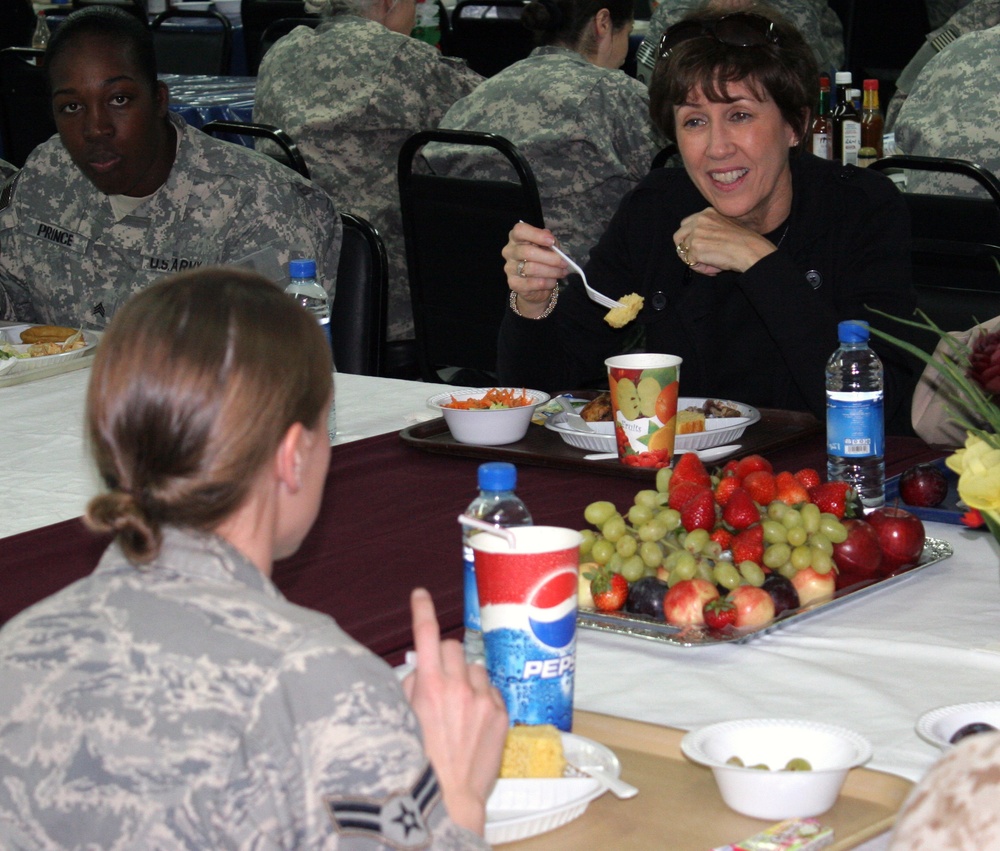 Wife of Army Chief of Staff and family advocate Sheila Casey pays a Christmas Eve visit to service members in Kuwait