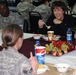 Wife of Army Chief of Staff and family advocate Sheila Casey pays a Christmas Eve visit to service members in Kuwait