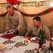 Commandant, sergeant major of the Marine Corps shares Christmas meal with Marines, sailors of RCT-2