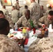 Commandant, sergeant major of the Marine Corps shares Christmas meal with Marines, sailors of RCT-2