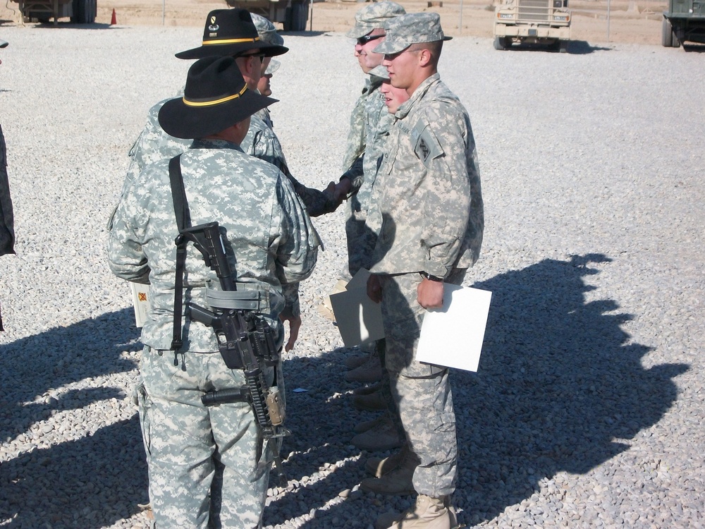 Transportation Soldiers receive spurs from Cavalry Squadron