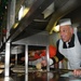 Carrier strike group commander serves Christmas dinner