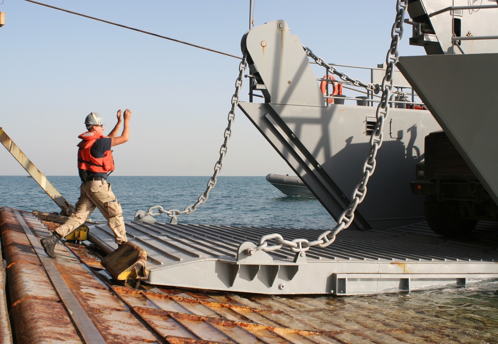 Joint efforts ensure USS Carter Hall lands in time for Christmas