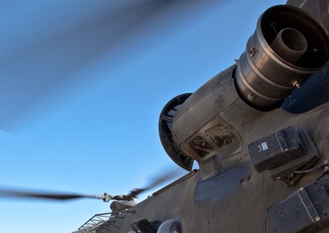 Soldiers Load Cargo on CH-47 Chinook Helicopter