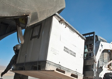 Soldiers Load Cargo on CH-47 Chinook Helicopter