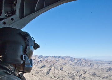 Soldiers Load Cargo on CH-47 Chinook Helicopter