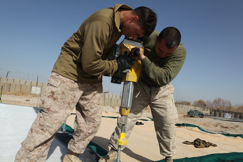 Expeditionary airfield Marines lay ground work for landing aircraft