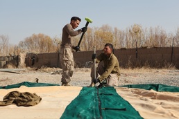 Expeditionary airfield Marines lay ground work for landing aircraft