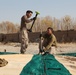 Expeditionary airfield Marines lay ground work for landing aircraft