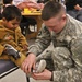 Soldiers distribute donated shoes to Iraqi children