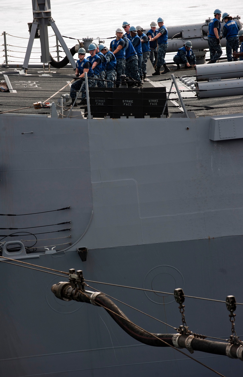 USS Stockdale approaches carrier for supplies