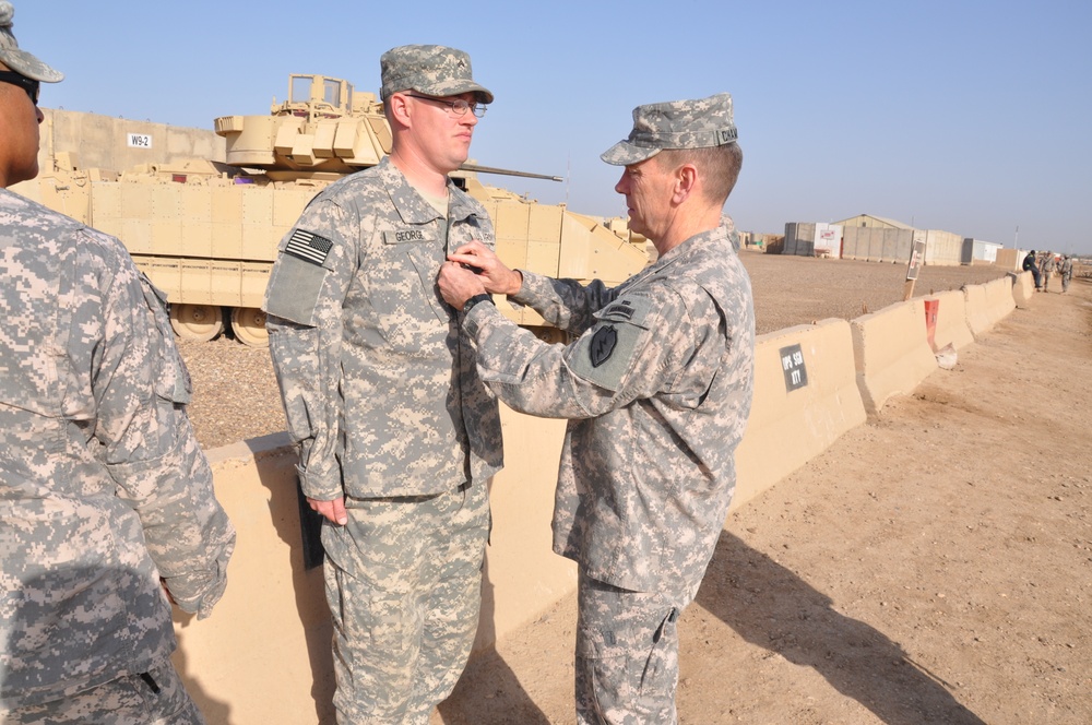 25th Inf. Div. command team promotes USD-C armor battalion Soldier