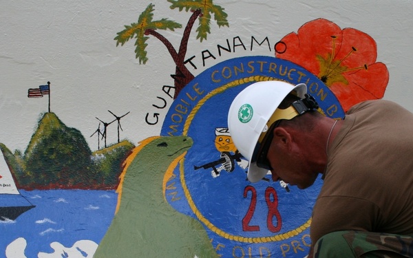 Sailor paints sign