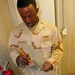Navy barber cuts detainee hair