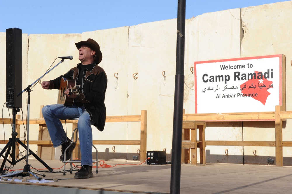 Country singer Michael Peterson performs in Iraq