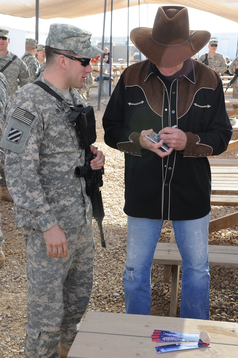 Country singer Michael Peterson performs in Iraq