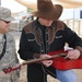 Country singer Michael Peterson performs in Iraq