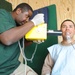 Hospital Corpsman conducts a dental x-ray