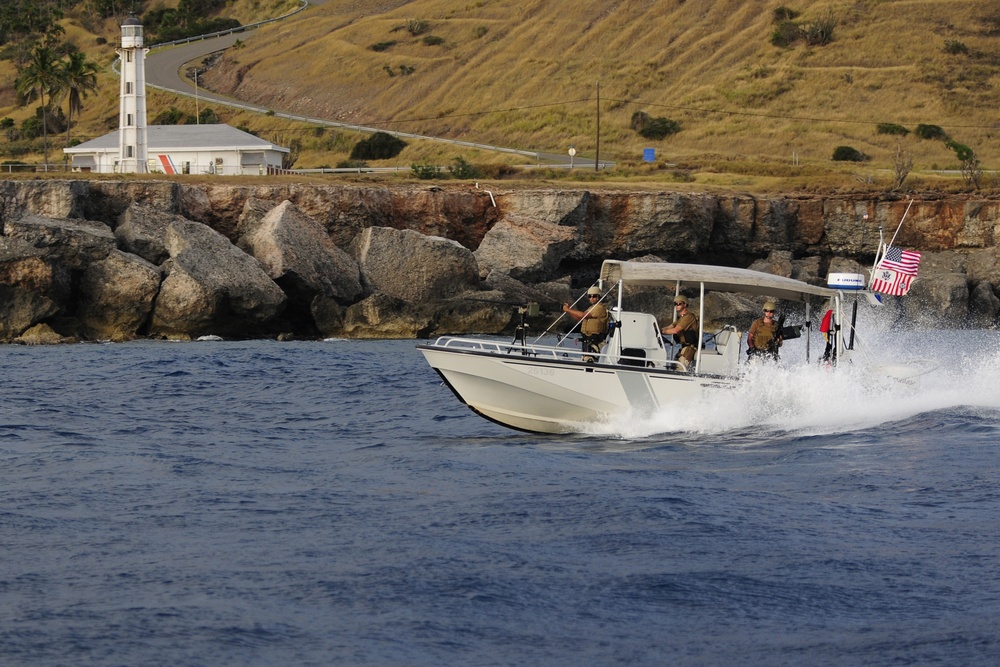 US Coast Guard Maritime Safety and Security Team (MSST) 91114 patrols the coastline of Guantanamo Bay
