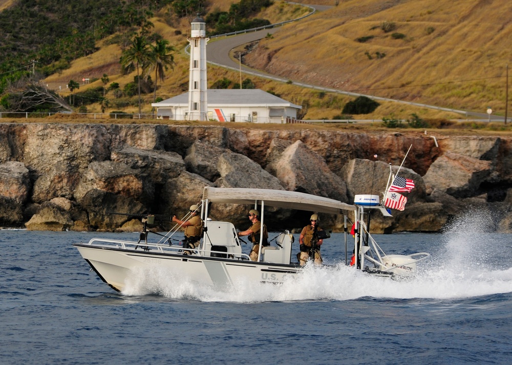 US Coast Guard Maritime Safety and Security Team (MSST) 91114 patrols the coastline of Guantanamo Bay