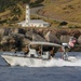 US Coast Guard Maritime Safety and Security Team (MSST) 91114 patrols the coastline of Guantanamo Bay