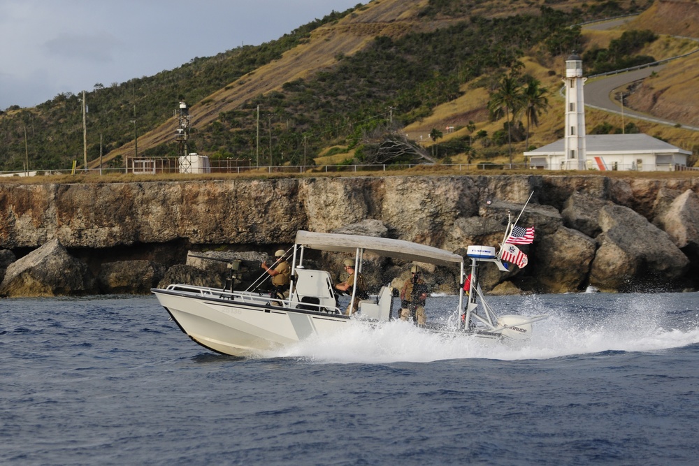 US Coast Guard Maritime Safety and Security Team (MSST) 91114 patrols the coastline of Guantanamo Bay