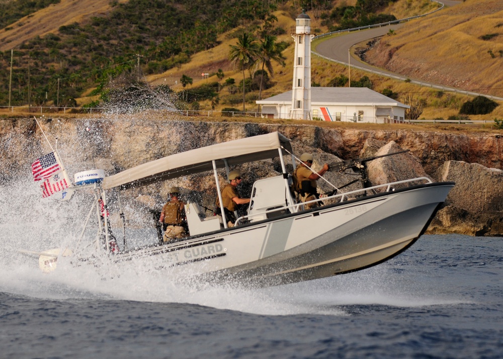US Coast Guard Maritime Safety and Security Team (MSST) 91114 patrols the coastline of Guantanamo Bay