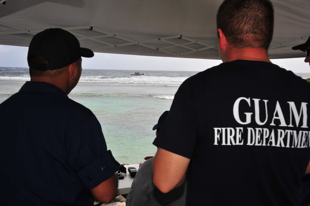 U.S. Coast Guard, U.S. Navy, Guam Fire Department, Guam Police Department search for missing firshermen