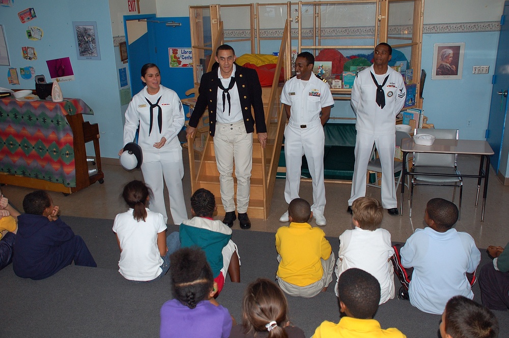 Sailors visits with children