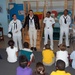 Sailors visits with children