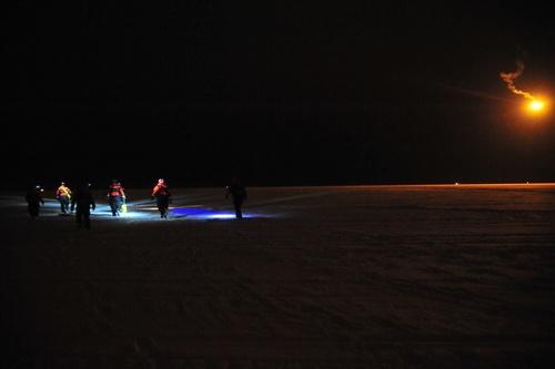 Coast Guardsmen practice ice rescue in the dark