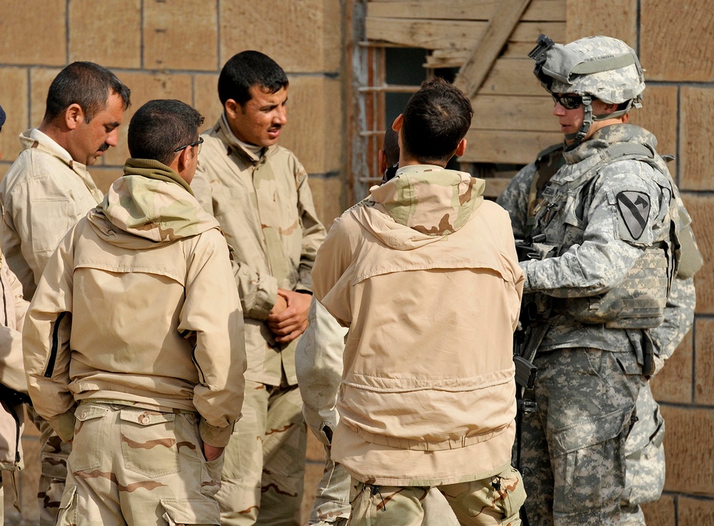 Sgt. Meegan speaks with Iraqi soldiers