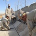 Seabees Lay AM2 matting for a basketball court