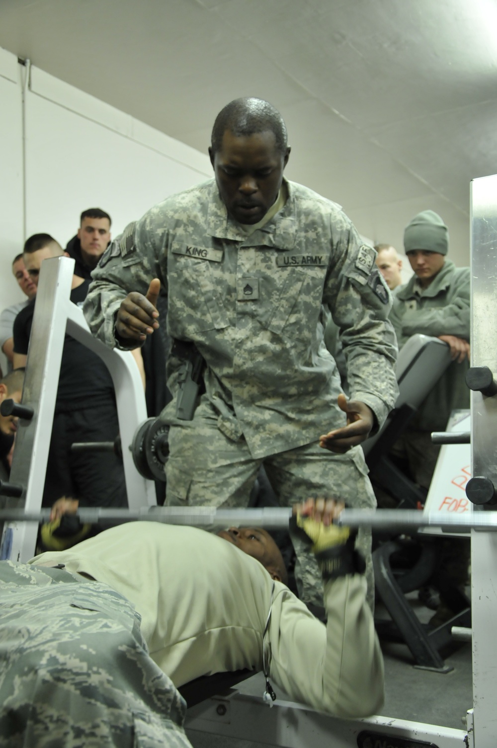 Service members participate in weightlifting competition