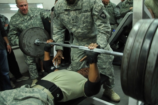 Service members participate in weightlifting competition